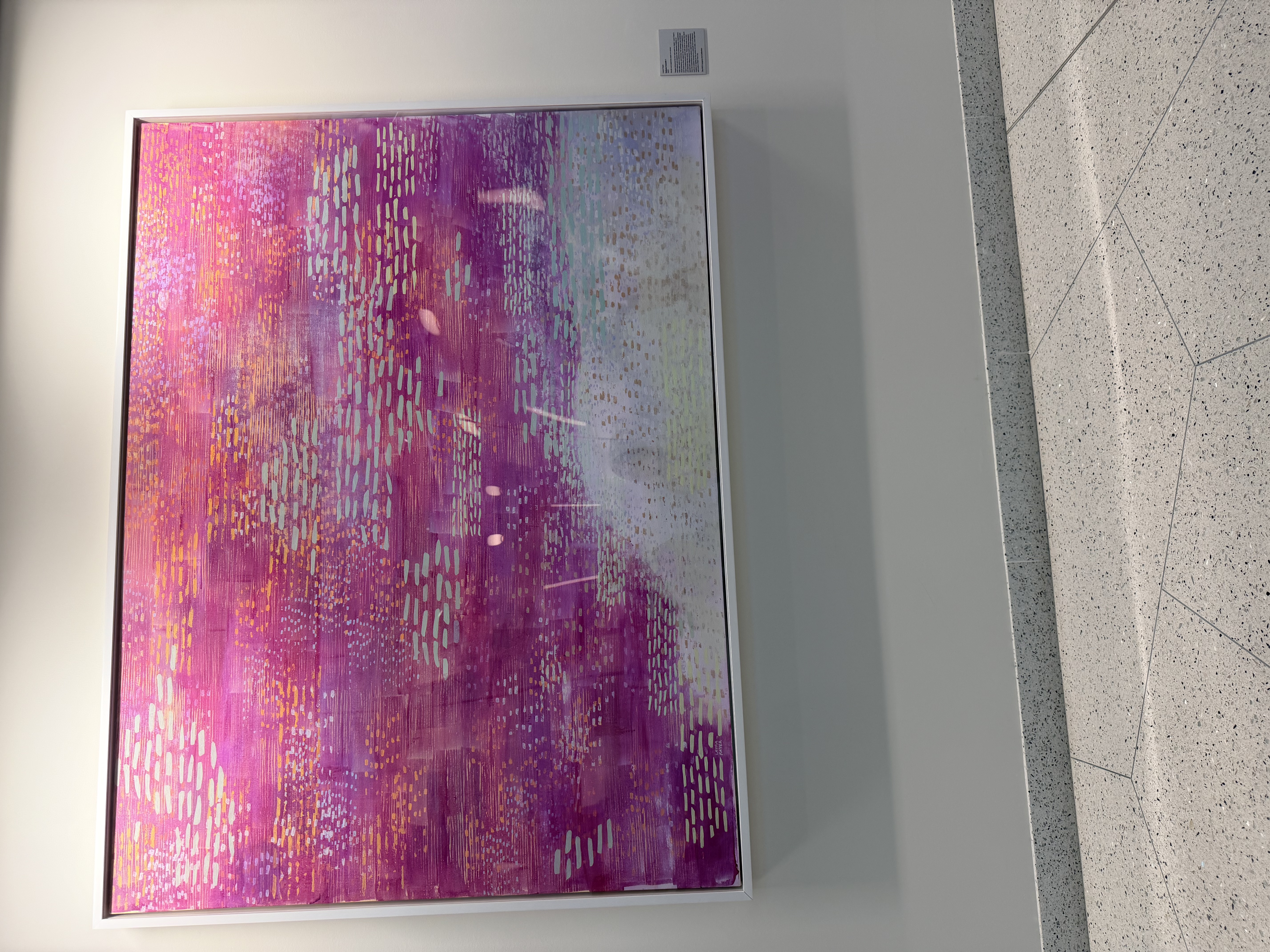 Colorful abstract painting on the wall of NYU Langone fertility clinic waiting room