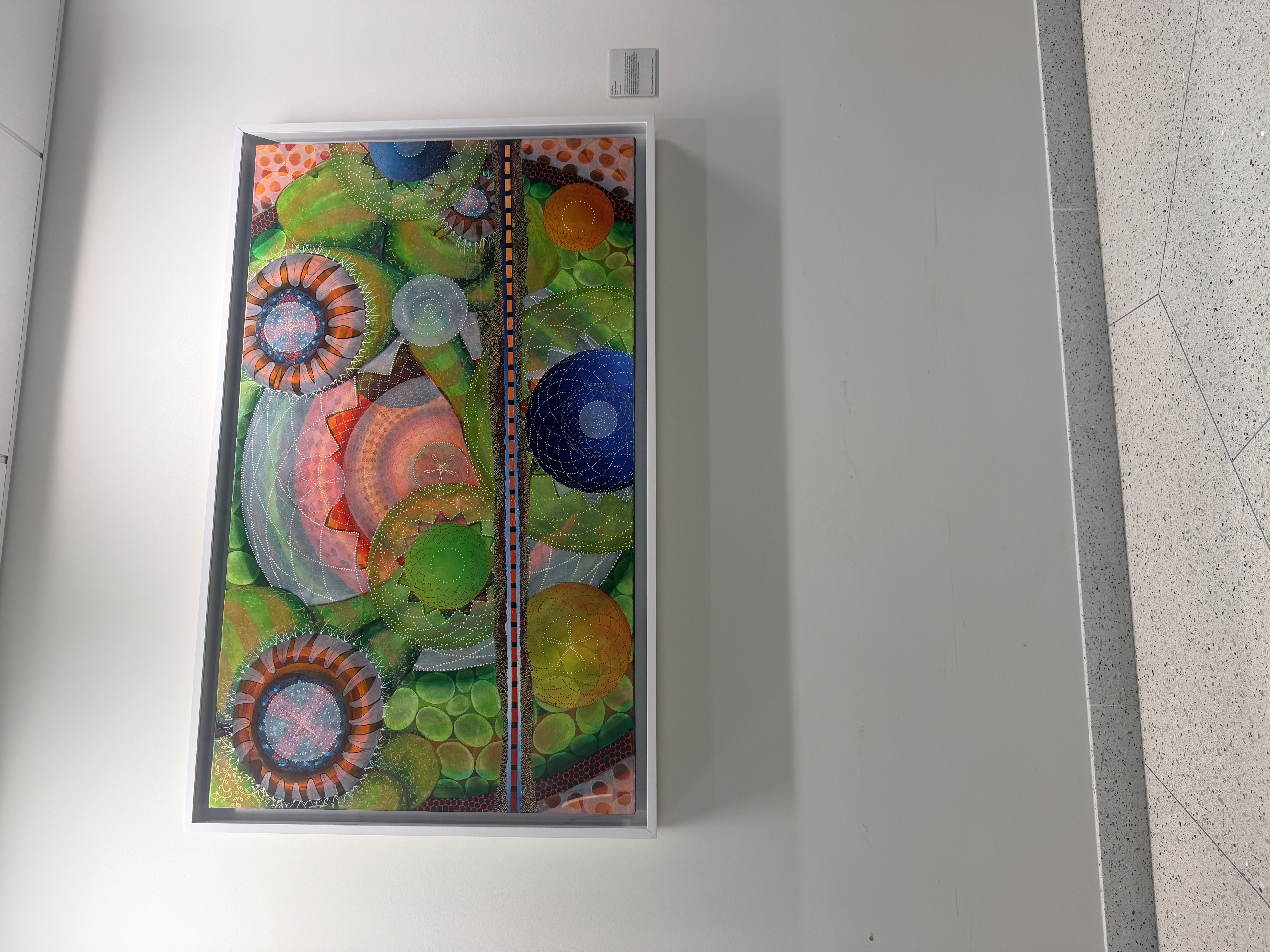 Artwork on the wall of the waiting area at the fertility center.